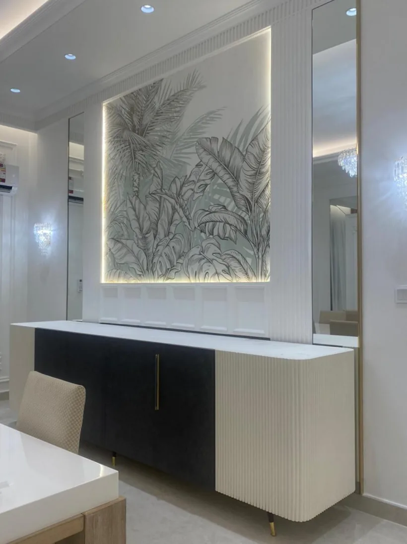 Sideboard below a backlit art panel